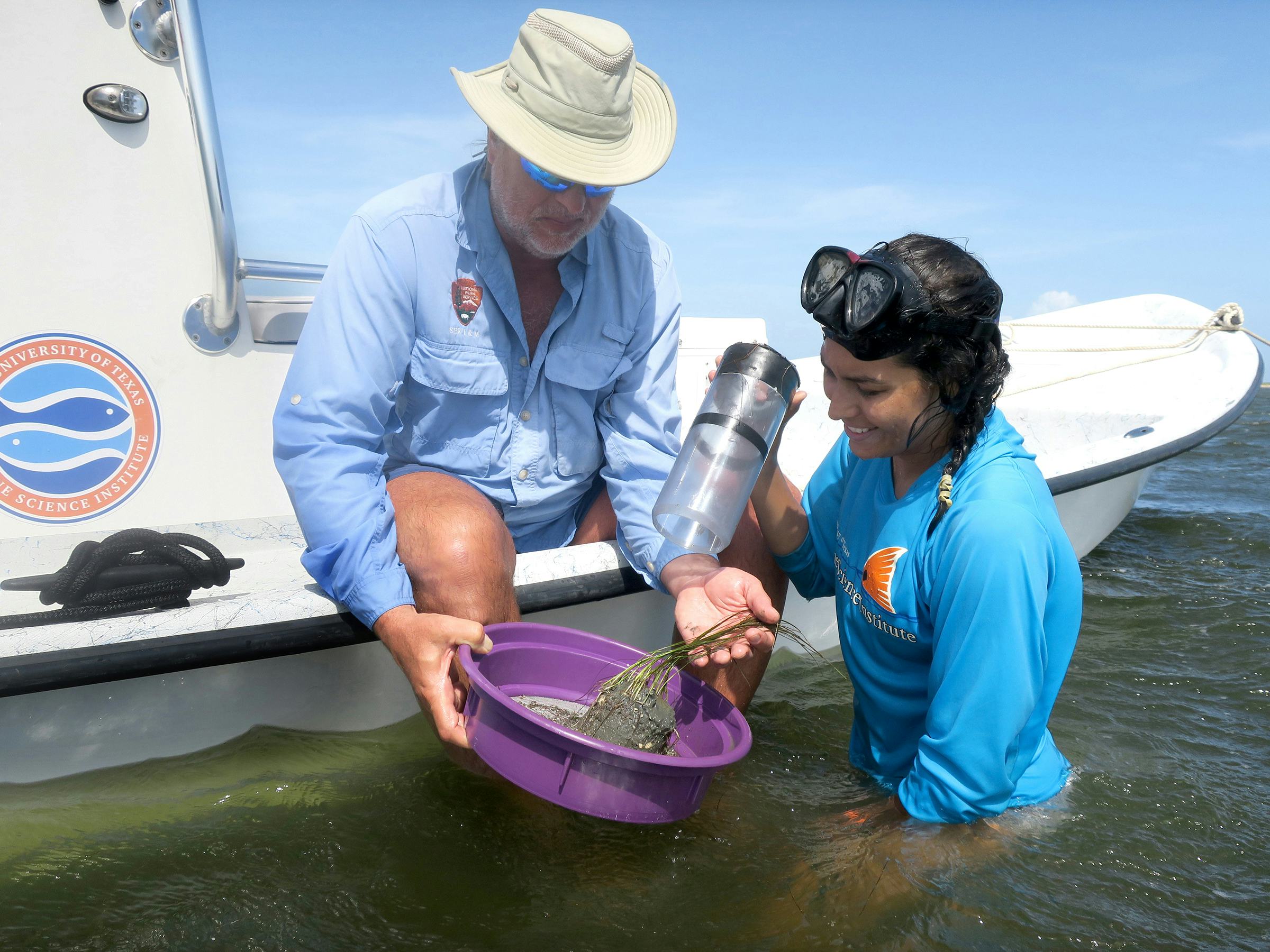 People obtaining plant samples from the water near Port Aransas, TX.