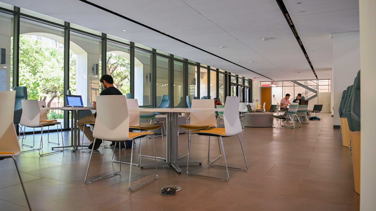 Students seated in a large study area in Welch Hall