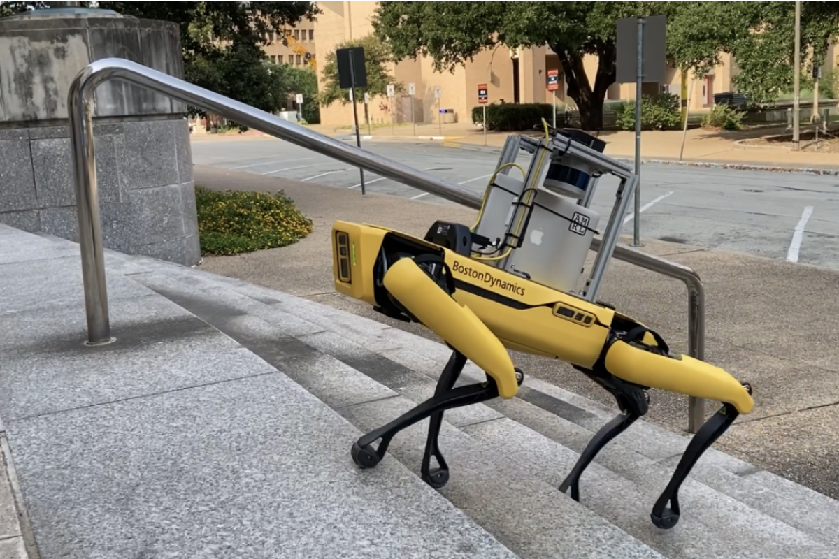 A robot with four legs climbs stairs on the UT Austin campus 