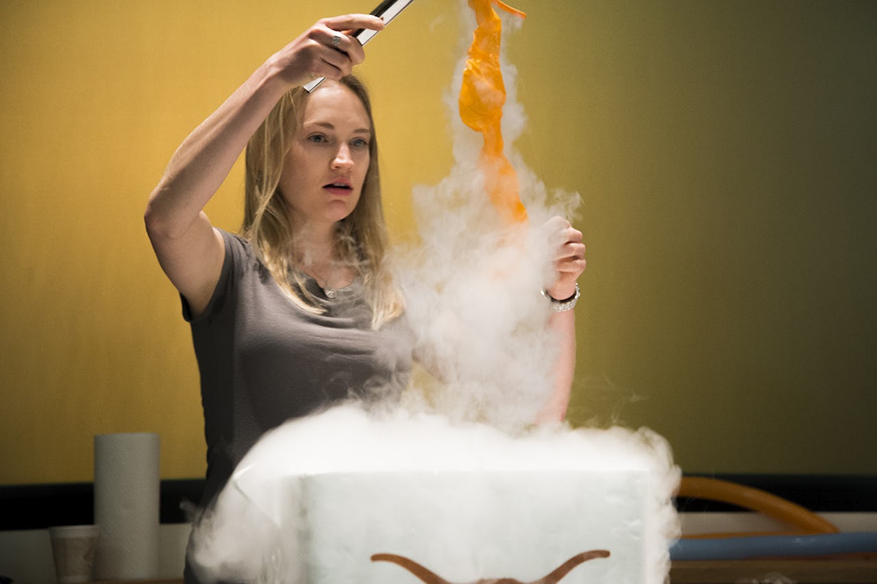 Tess Bernard demonstrates what happens when air in a balloon is cooled in liquid nitrogen.