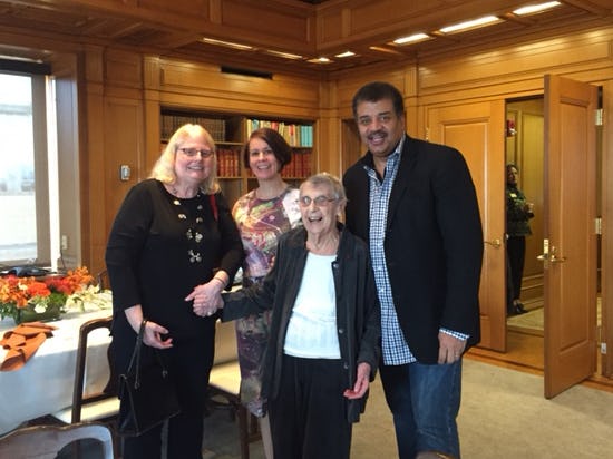 Daughter Chris DeWitt, alumna Alice Young, Cécile DeWitt-Morette and alumnus Neil DeGrasse Tyson on campus in January. Young was a graduate student under DeWitt-Morette.