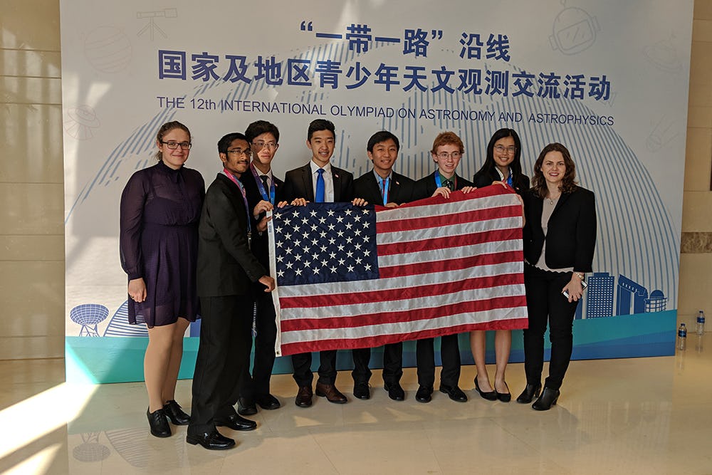 The USA Team in Beijing. From left to right: Ioana Zelko (Team Leader), Sahil Pontula, Vincent Brian, David Yue (also a Texan), Andy Zhu, Texan and gold medalist Joseph McCarty, April Cheng and UT Austin graduate student Nastasa Dragovic (Team Leader). Photo from the USAAAO.