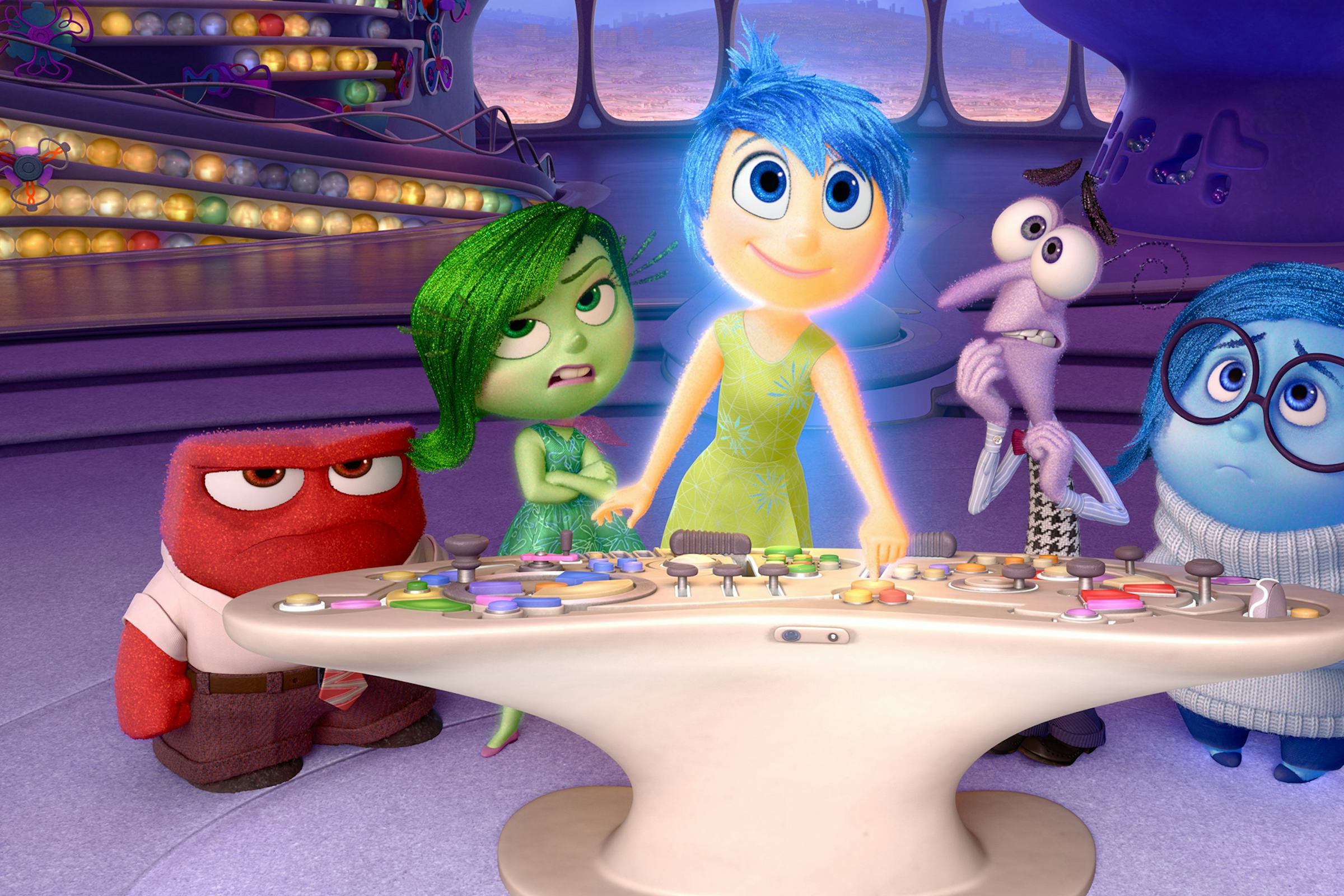 Cartoon characters representing different feelings stand around a control console