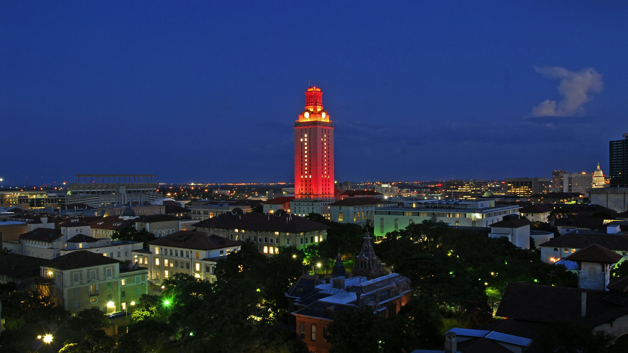 The UT Tower at night lit orange with a 1 in celebration of victory
